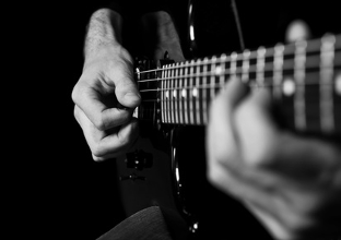 Man Playing Guitar - Audio Mastering